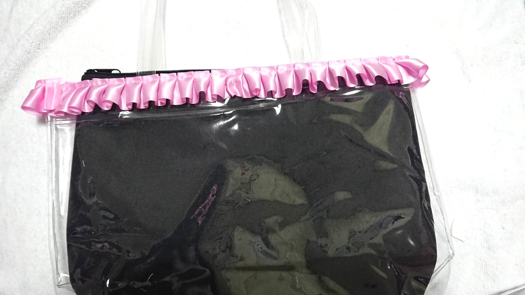 attached a pleated ribbon to the top of the clear bag
